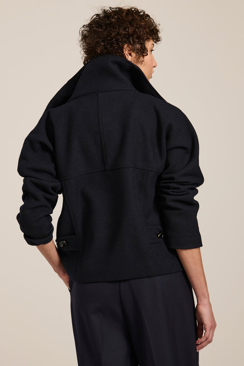 Women's wool-blend wrap jacket with oversized convertible collar and patch pockets.