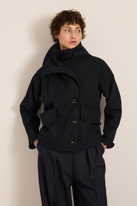 Women's wool-blend wrap jacket with oversized convertible collar and patch pockets.