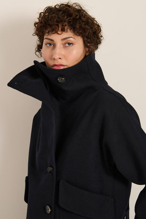 Women's wool-blend wrap jacket with oversized convertible collar and patch pockets.