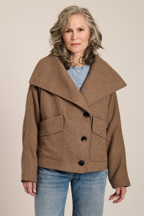Women's wool-blend wrap jacket with oversized convertible collar and patch pockets.
