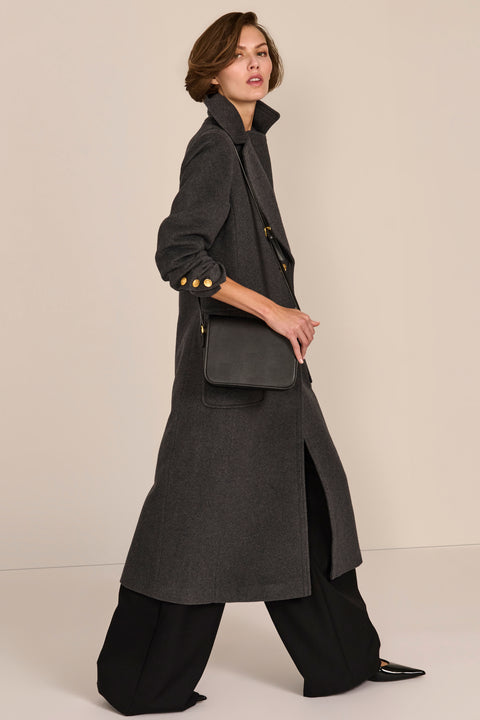 classic  wool coat with calf length cut and patch pockets ideal for adding sophistication to everyday outfits