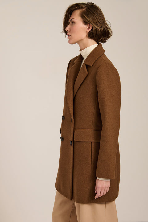 Women's double-breasted blazer coat with tailored lapels and mid-thigh silhouette.