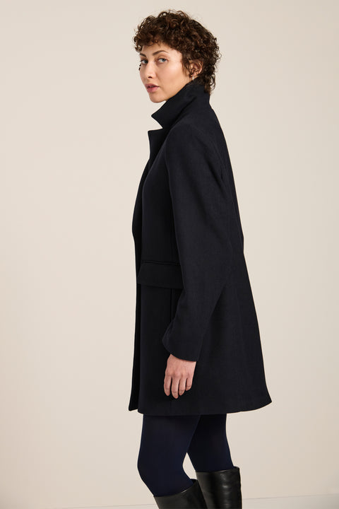 Women's double-breasted blazer coat with tailored lapels and mid-thigh silhouette.