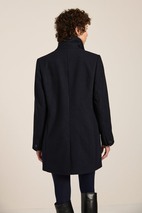 Women's double-breasted blazer coat with tailored lapels and mid-thigh silhouette.
