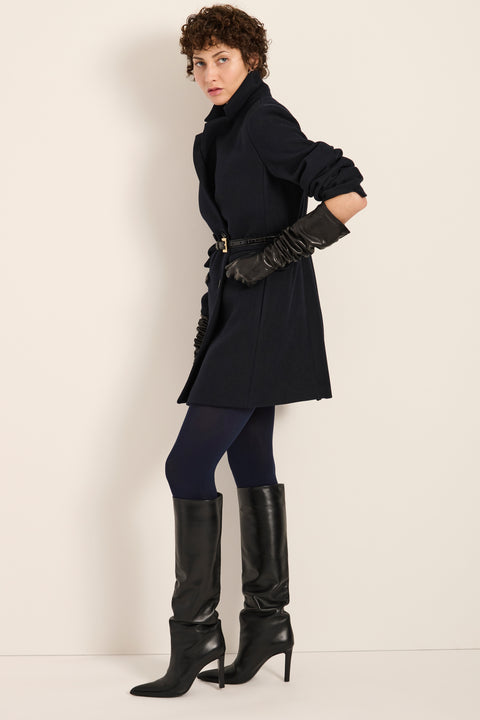 Women's double-breasted blazer coat with tailored lapels and mid-thigh silhouette.