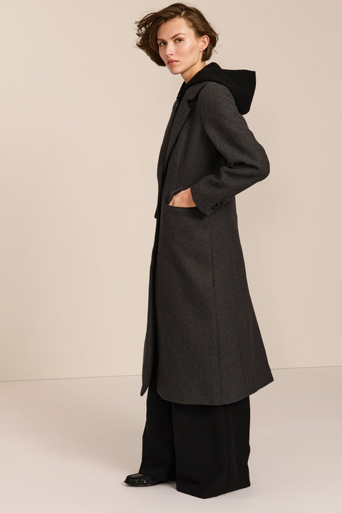 women's wool coat with a notched collar, flap pockets and zip-front hooded knit bib.