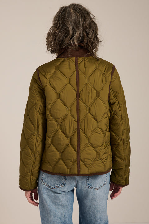 Women's quilted jacket with corduroy collar, snap-front closure, and patch pockets in olive green