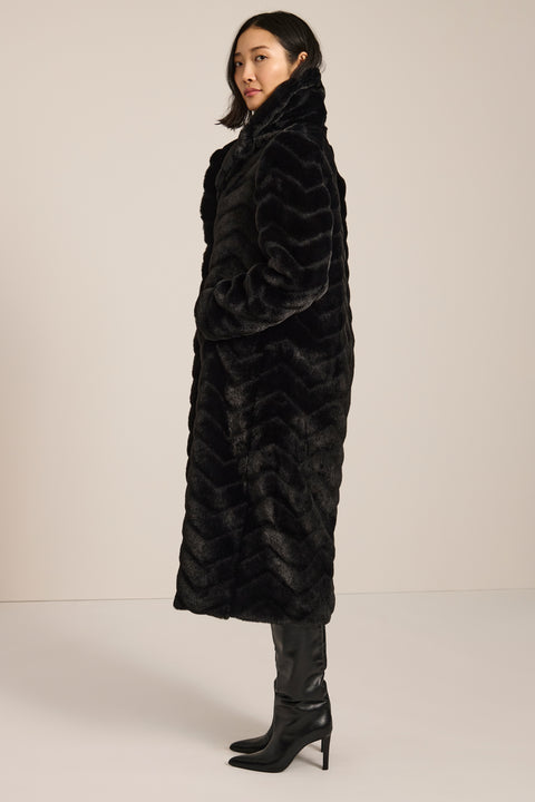 Long faux fur coat with chevron-textured finish, notch collar, button-front closure and full-length silhouette