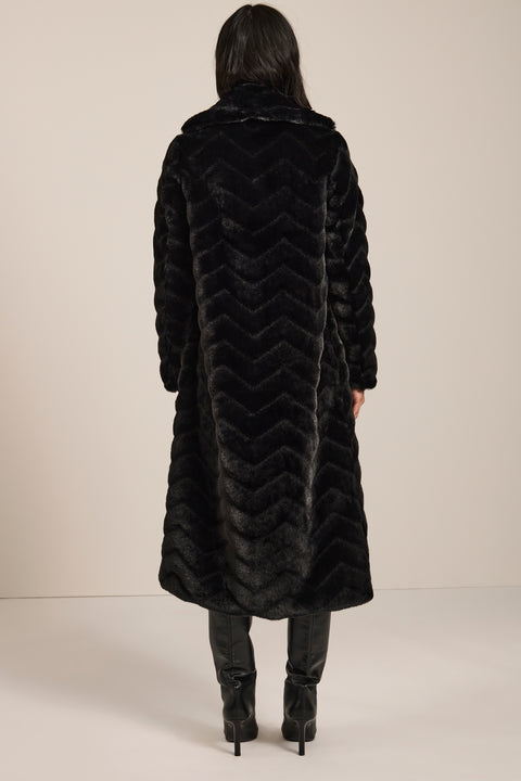 Long faux fur coat with chevron-textured finish, notch collar, button-front closure and full-length silhouette