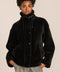 women's sherpa jacket featuring a high funnel collar, adjustable drawcords, concealed snap-front closure and side pockets.