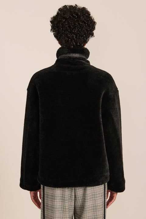 women's sherpa jacket featuring a high funnel collar, adjustable drawcords, concealed snap-front closure and side pockets.