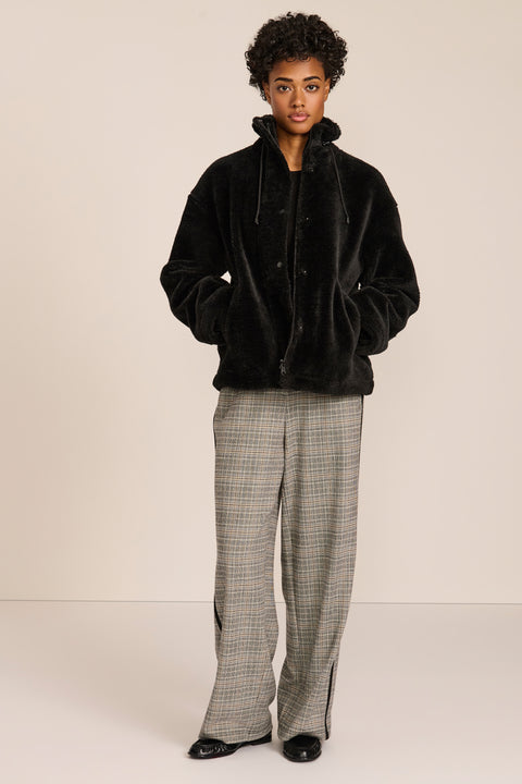 women's sherpa jacket featuring a high funnel collar, adjustable drawcords, concealed snap-front closure and side pockets.