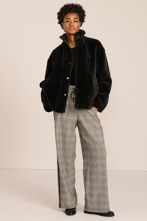 women's sherpa jacket featuring a high funnel collar, adjustable drawcords, concealed snap-front closure and side pockets.
