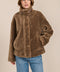 women's sherpa jacket featuring a high funnel collar, adjustable drawcords, concealed snap-front closure and side pockets.