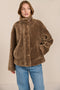 women's sherpa jacket featuring a high funnel collar, adjustable drawcords, concealed snap-front closure and side pockets.