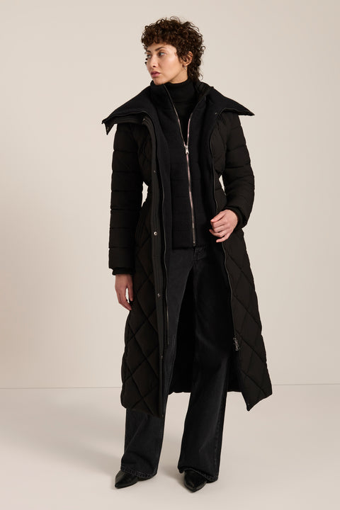Belted quilted puffer coat with oversized diamond quilting, removable knit bib and stand collar.