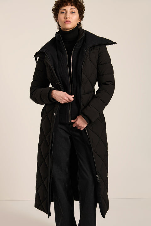Belted quilted puffer coat with oversized diamond quilting, removable knit bib and stand collar.