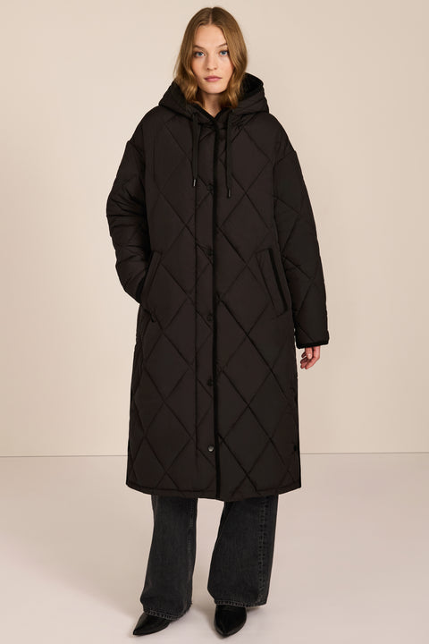 Oversized long puffer coat with diamond quilting, corduroy trim, hood, welt pockets, and Ecoplume insulation.