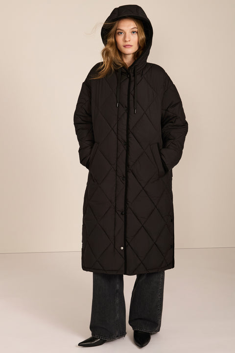 Oversized long puffer coat with diamond quilting, corduroy trim, hood, welt pockets, and Ecoplume insulation.