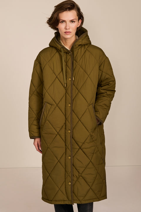 Oversized long puffer coat with diamond quilting, corduroy trim, hood, welt pockets, and Ecoplume insulation.