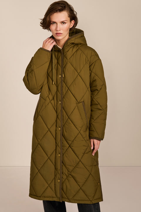 Oversized long puffer coat with diamond quilting, corduroy trim, hood, welt pockets, and Ecoplume insulation.