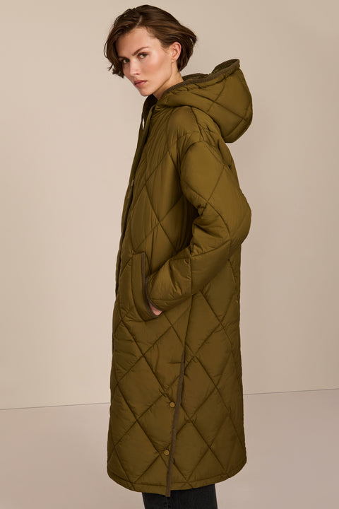 Oversized long puffer coat with diamond quilting, corduroy trim, hood, welt pockets, and Ecoplume insulation.