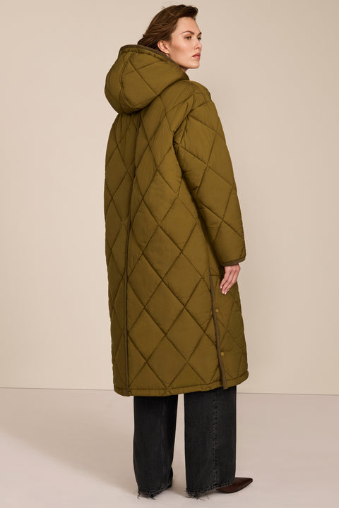 Oversized long puffer coat with diamond quilting, corduroy trim, hood, welt pockets, and Ecoplume insulation.