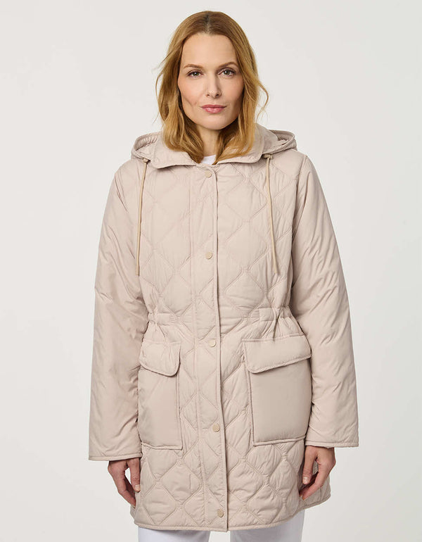 Women’s quilted utility jacket with flap pockets, snap front closure, attached hood, and cinched drawstring waist.