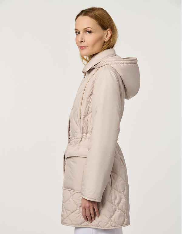 Women’s quilted utility jacket with flap pockets, snap front closure, attached hood, and cinched drawstring waist.