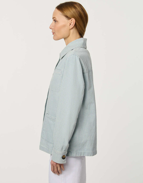 Women’s striped denim jacket with a relaxed fit and tortoise shell buttons.