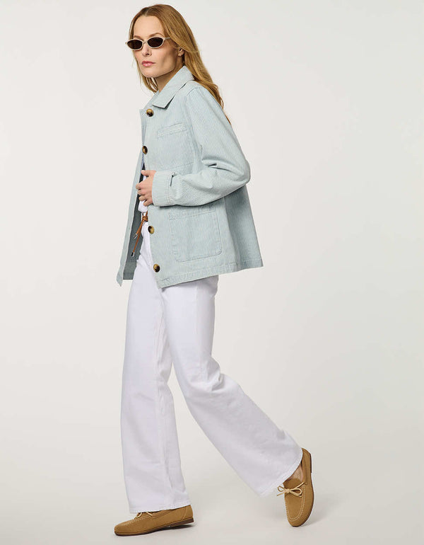 Women’s striped denim jacket with a relaxed fit and tortoise shell buttons.