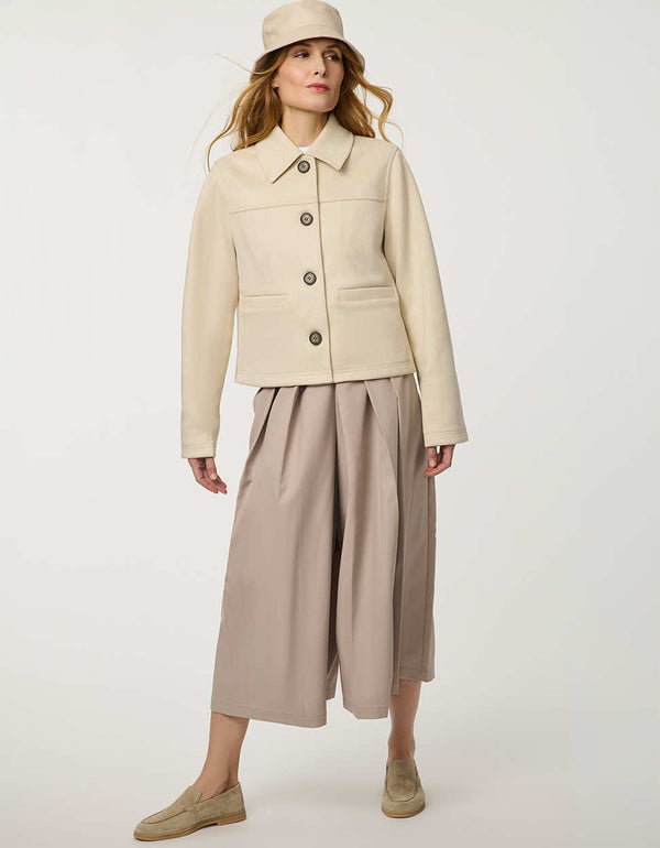 Women’s faux suede jacket with a smooth finish, clean silhouette, and contrast buttons.