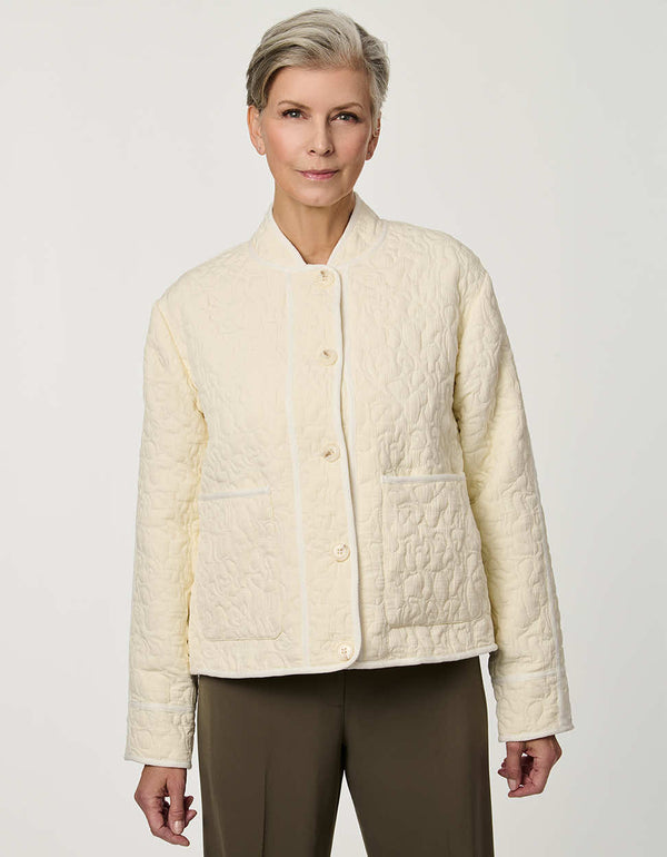 Women’s lightweight quilted jacket with jacquard quilting, tonal piping, and streamlined silhouette.