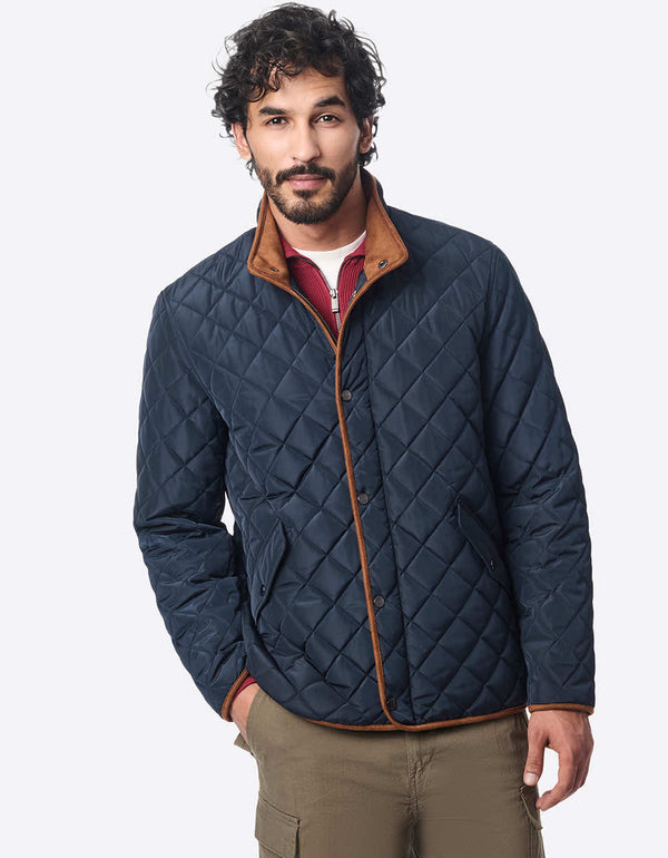 mens deep blue quilted jacket featuring eco friendly insulation faux suede inner collar and water resistance