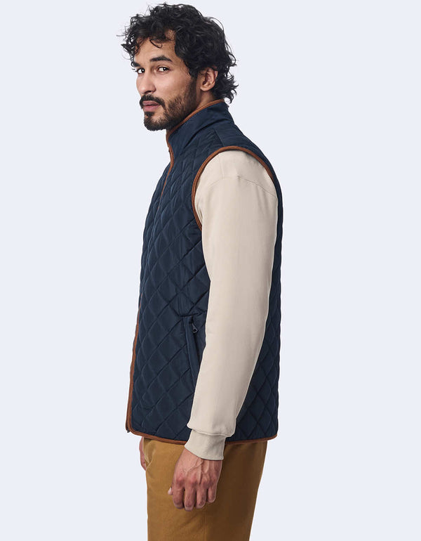 men's quilted vest made with sustainable materials. Lightweight style with contrast lining and two-way zipper.