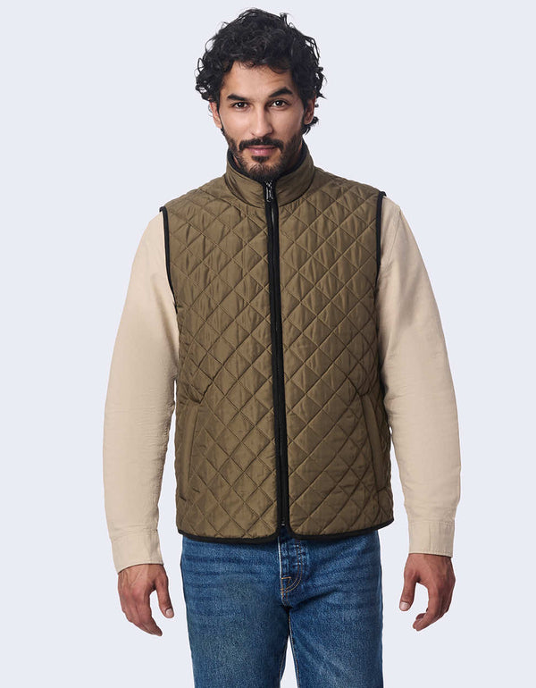 men's quilted vest made with sustainable materials. Lightweight style with contrast lining and two-way zipper.