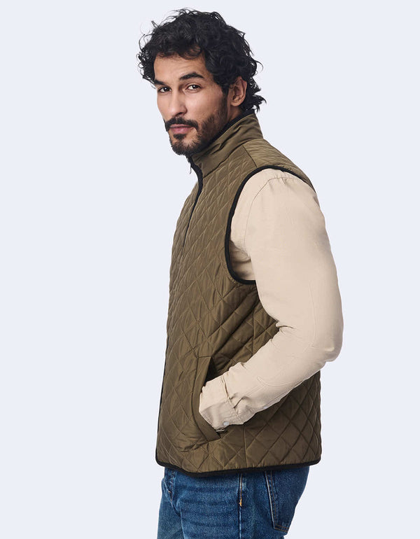 men's quilted vest made with sustainable materials. Lightweight style with contrast lining and two-way zipper.