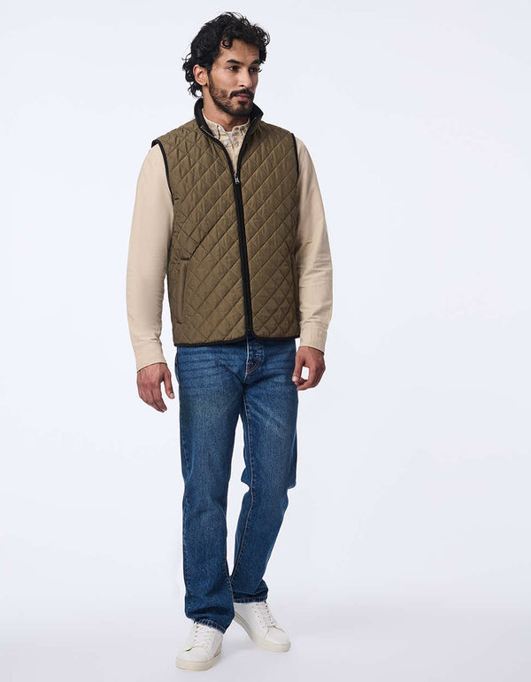 men's quilted vest made with sustainable materials. Lightweight style with contrast lining and two-way zipper.