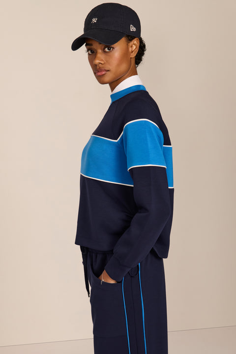 Women's navy and blue colorblock soft scuba sweatshirt with contrast piping and crew neckline.