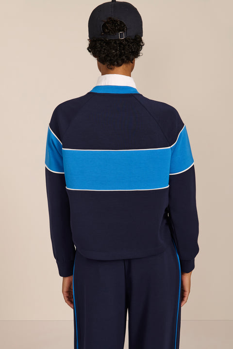 Women's navy and blue colorblock soft scuba sweatshirt with contrast piping and crew neckline.