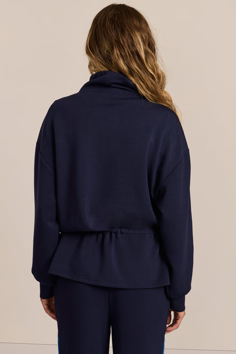 women's soft scuba full-zip jacket with blue contrast piping, high funnel collar and cinched waist.
