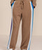 Women's soft scuba wide-leg pants with blue, white and red colorblocked side stripes and drawstring waist.