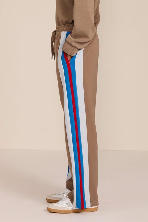 Women's soft scuba wide-leg pants with blue, white and red colorblocked side stripes and drawstring waist.