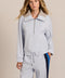 Sporty yet polished. Two ways to wear it, one effortlessly modern layer. Crafted from soft scuba fabric, this relaxed sweatshirt is elevated by a sculptural contrast collar and quarter-zip neckline. Ribbed cuffs and an easy silhouette bring laid-back appeal, while the unexpected colorblocking gives it a distinctly modern finish. The convertible collar can be worn open or zipped into a dramatic funnel neck, while a drawstring hem lets you play with the shape. Pair it with the coordinating pant for an effortl