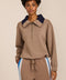 Women's soft scuba quarter-zip sweatshirt with navy contrast collar and relaxed fit.