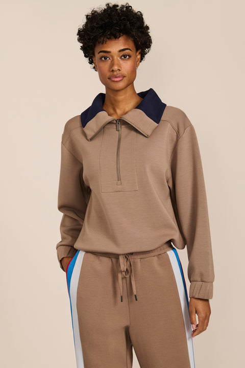 Women's soft scuba quarter-zip sweatshirt with navy contrast collar and relaxed fit.