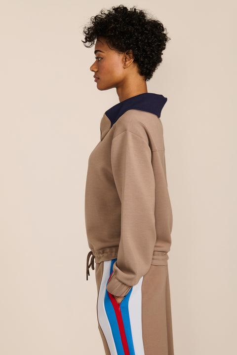 Women's soft scuba quarter-zip sweatshirt with navy contrast collar and relaxed fit.