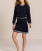 women's navy knit bomber jacket with zip front and ivory striped collar, cuffs and hem.