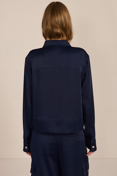 women's navy satin-finish zip-front utility jacket with pointed collar, flap chest pockets and silver-tone hardware.