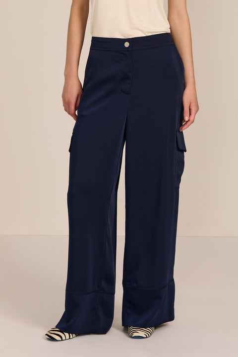 women's satin-finish wide-leg cargo pants with flap pockets and silver-tone snap hardware.